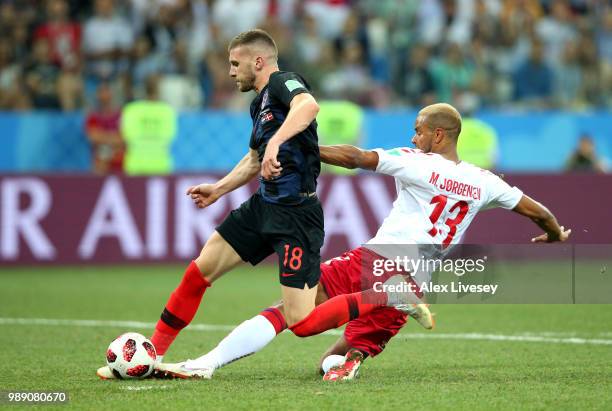 Mathias Jorgensen of Denmark fouls Ante Rebic of Croatia to give Croatia a penalty during the 2018 FIFA World Cup Russia Round of 16 match between...