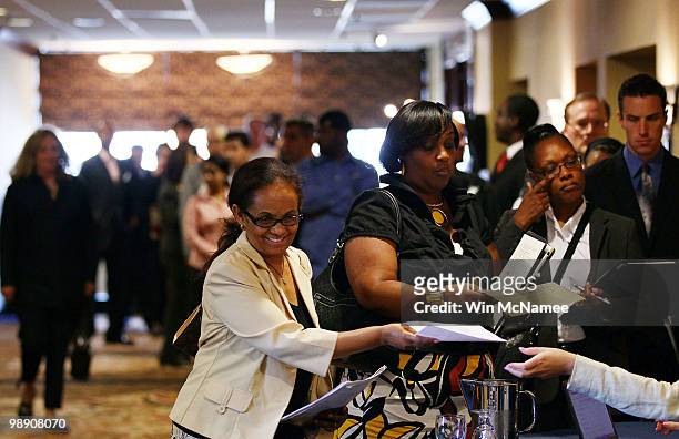 Job applicants line up for interviews at a career fair hosted by National Career Fairs May 7, 2010 in McLean, Virginia. The U.S. Economy added...