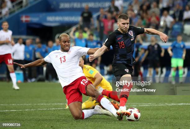 Mathias Jorgensen of Denmark fouls Ante Rebic of Croatia to give Croatia a penalty during the 2018 FIFA World Cup Russia Round of 16 match between...