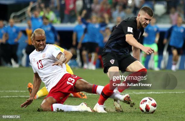 Mathias Jorgensen of Denmark fouls Ante Rebic of Croatia to give Croatia a penalty during the 2018 FIFA World Cup Russia Round of 16 match between...