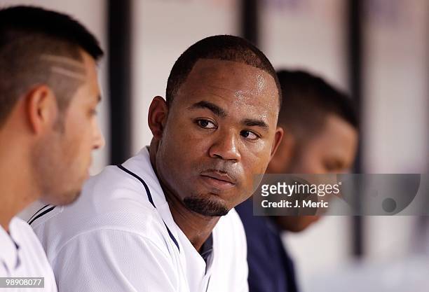 Outfielder Carl Crawford of the Tampa Bay Rays talks with Jason Bartlett on the bench during the game against the Kansas City Royals at Tropicana...