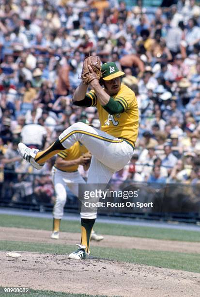 Pitcher Jim Catfish Hunter of the Oakland Athletics pitches circa early 1970's during a Major League baseball game. Hunter played for the Athletics...