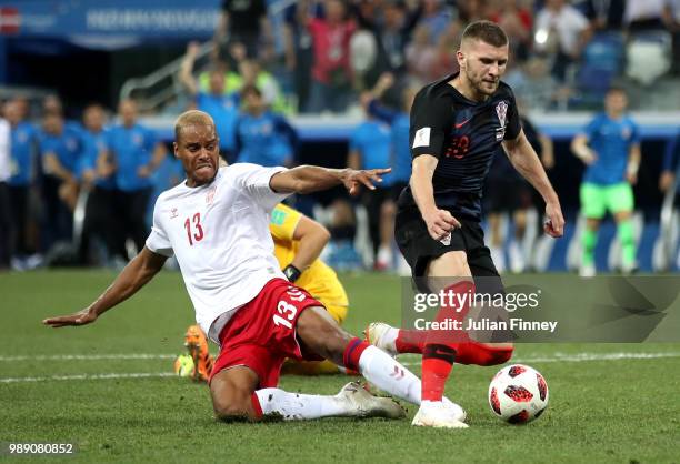Mathias Jorgensen of Denmark fouls Ante Rebic of Croatia to give Croatia a penalty during the 2018 FIFA World Cup Russia Round of 16 match between...