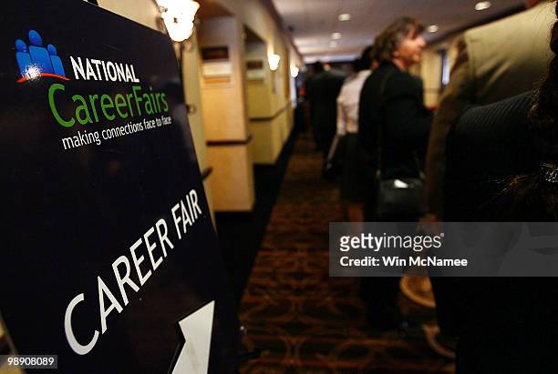 Job applicants line up for interviews at a career fair hosted by National Career Fairs May 7, 2010 in McLean, Virginia. The U.S. Economy added...