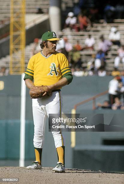Pitcher Jim Catfish Hunter of the Oakland Athletics pitches from the stretch circa early 1970's during a Major League baseball game. Hunter played...