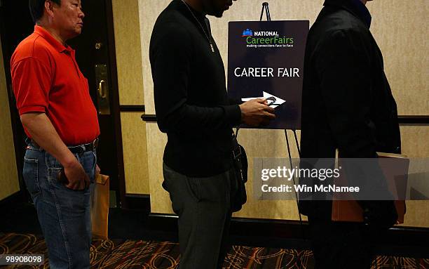 Job applicants line up for interviews at a career fair hosted by National Career Fairs May 7, 2010 in McLean, Virginia. The U.S. Economy added...