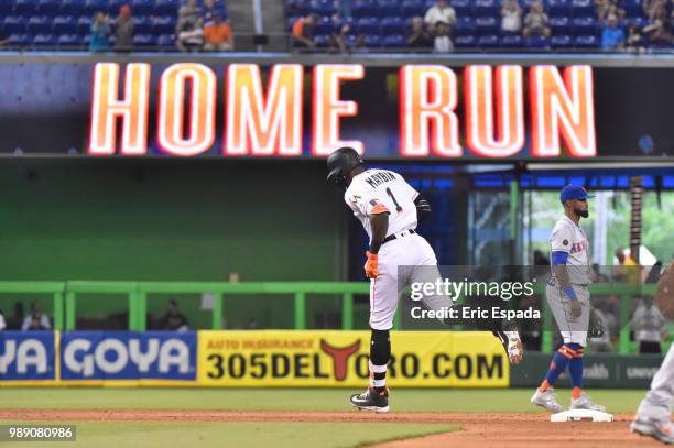 Cameron Maybin of the Miami Marlins rounds second base after hitting a home run in the eighth inning against the New York Mets at Marlins Park on...