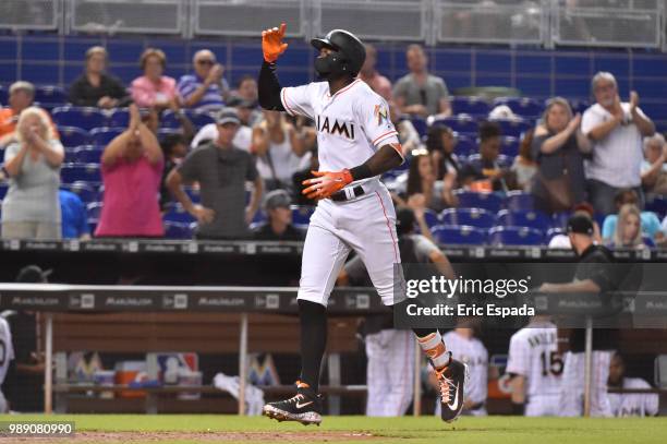 Cameron Maybin of the Miami Marlins points to sky after hitting a home run in the eighth inning against the New York Mets at Marlins Park on July 1,...