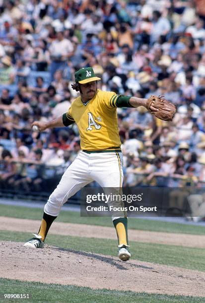 Pitcher Jim Catfish Hunter of the Oakland Athletics pitches circa early 1970's during a Major League baseball game. Hunter played for the Athletics...