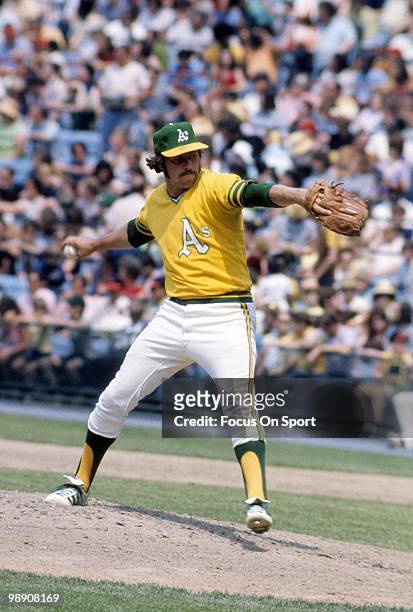 Pitcher Jim Catfish Hunter of the Oakland Athletics pitches circa early 1970's during a Major League baseball game. Hunter played for the Athletics...