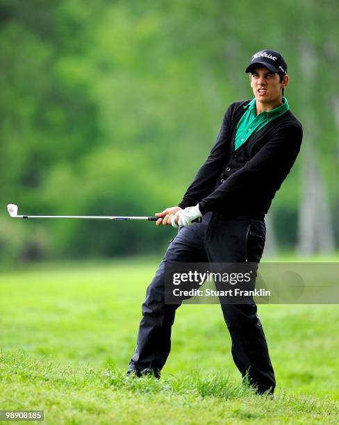 Matteo Manassero of Italy plays his approach shot on the 14th hole during the second round of the BMW Italian Open at Royal Park I Roveri on May 7,...