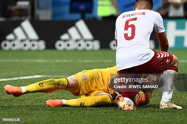 Denmark's defender Jonas Knudsen celebrates with Denmark's goalkeeper Kasper Schmeichel after he saved a penalty during the Russia 2018 World Cup...