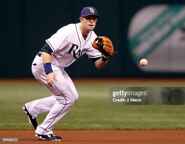 Infielder Evan Longoria of the Tampa Bay Rays fields a ground ball against the Kansas City Royals during the game at Tropicana Field on May 1, 2010...