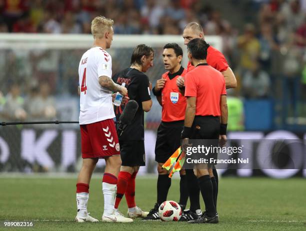 Referee Nestor Pitana talks to Luka Modric of Croatia and Simon Kjaer of Denmark before the penalty shoot out during the 2018 FIFA World Cup Russia...