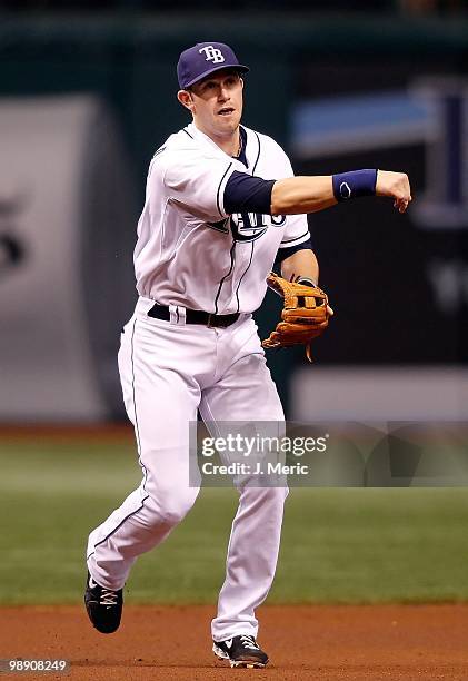 Infielder Evan Longoria of the Tampa Bay Rays throws over to first for an out against the Kansas City Royals during the game at Tropicana Field on...