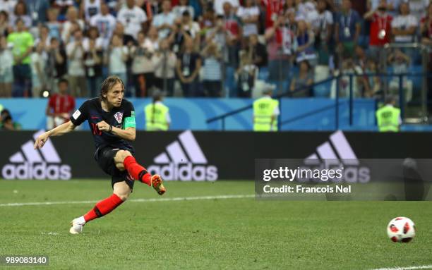 Luka Modric of Croatia scores his team's third penalty in the penalty shoot out during the 2018 FIFA World Cup Russia Round of 16 match between...