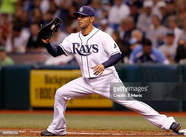 Infielder Carlos Pena of the Tampa Bay Rays takes the throw at first against the Kansas City Royals during the game at Tropicana Field on May 1, 2010...
