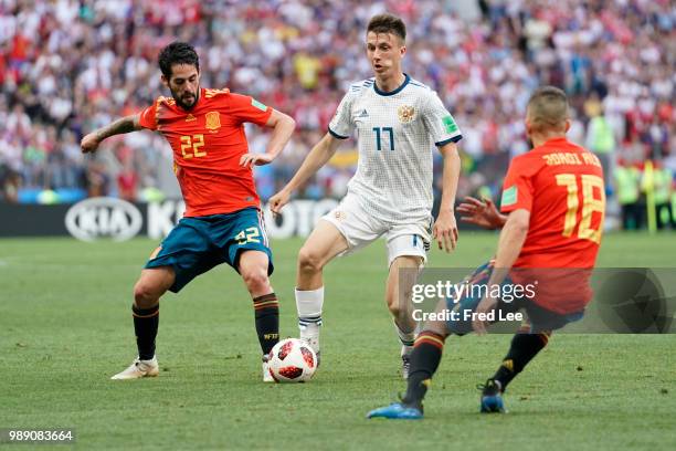 Roman Zobnin of Russia is challenged by Isco of Spain during the 2018 FIFA World Cup Russia Round of 16 match between Spain and Russia at Luzhniki...