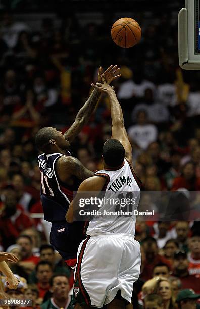 Jamal Crawford of the Atlanta Hawks puts up a shot over Kurt Thomas of the Milwaukee Bucks in Game Six of the Eastern Conference Quarterfinals during...