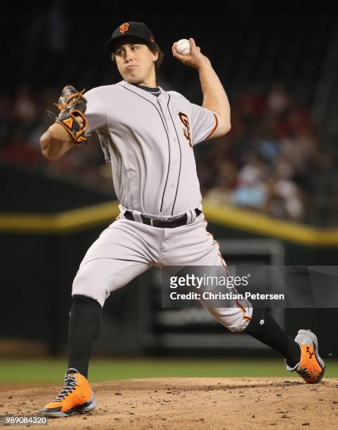 Starting pitcher Derek Holland of the San Francisco Giants pitches against the Arizona Diamondbacks during first inning of the MLB game at Chase...
