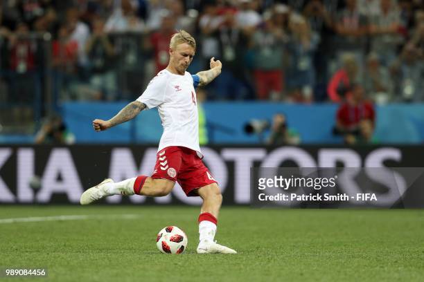 Simon Kjaer of Denmark scores his team's second penalty in the penalty shoot out during the 2018 FIFA World Cup Russia Round of 16 match between...