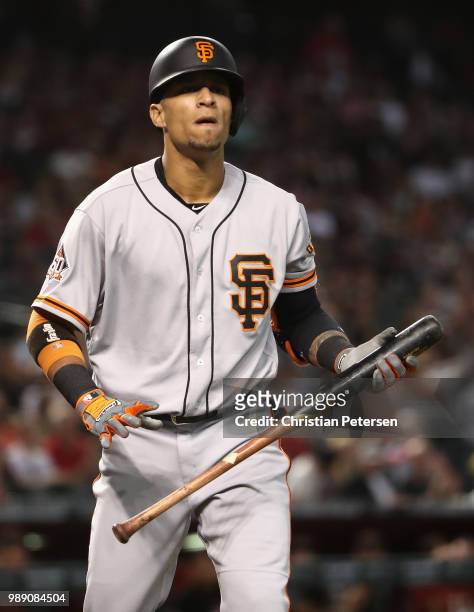 Gorkys Hernandez of the San Francisco Giants reacts after striking out against the Arizona Diamondbacks during the first inning of the MLB game at...
