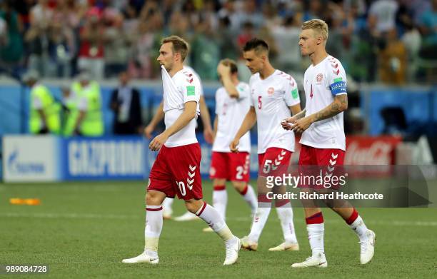 Denmark players look dejected following the 2018 FIFA World Cup Russia Round of 16 match between Croatia and Denmark at Nizhny Novgorod Stadium on...