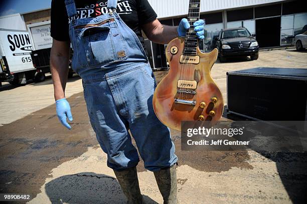 Brent Ware pulls a 1952 Gibson Les Paul valued at $100,000 from the city's largest musician equiptment storage faciltiy Soundcheck Nashville on May...