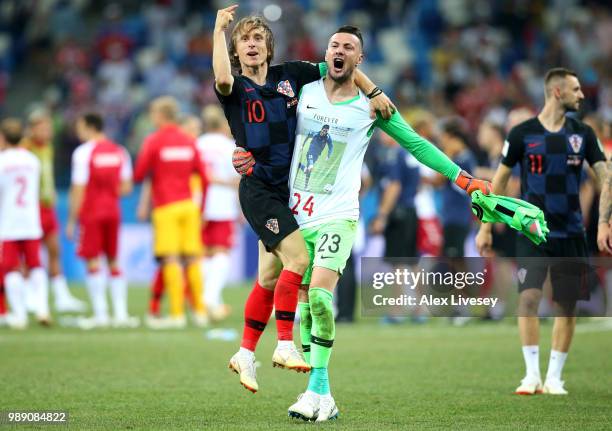 Luka Modric and Danijel Subasic of Croatia celebrate their victory following the 2018 FIFA World Cup Russia Round of 16 match between Croatia and...