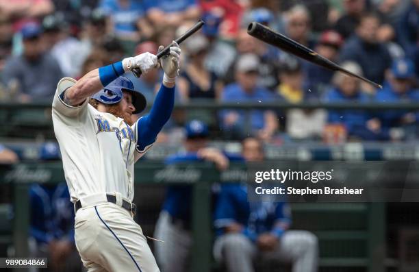 Ben Gamel of the Seattle Mariners breaks his bat as he hits a one-run single off of starting pitcher Brad Keller of the Kansas City Royals that...