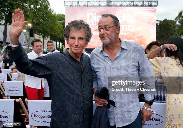 French actor Jean Reno and former Minister of Culture Jack Lang, attend the event "A Sunday at the Cinema" on the Avenue des Champs-Elysees on July...