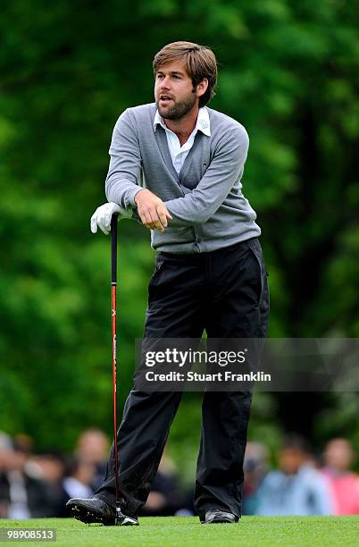 Robert Rock of England reacts to his approach shot on the 18th hole during the second round of the BMW Italian Open at Royal Park I Roveri on May 7,...