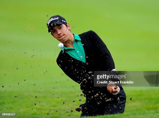 Matteo Manassero of Italy plays his bunker shot on the 16th hole during the second round of the BMW Italian Open at Royal Park I Roveri on May 7,...