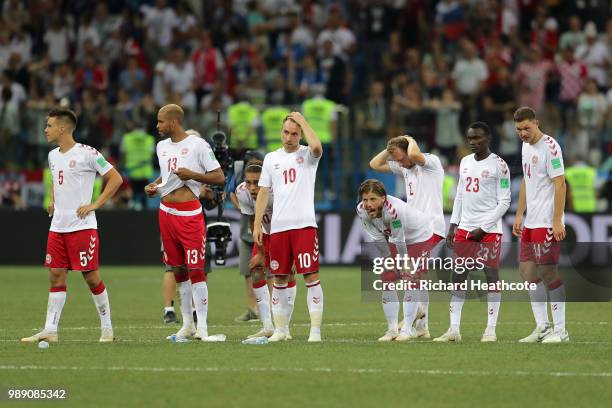 Denmark players look dejected following their sides defeat in the 2018 FIFA World Cup Russia Round of 16 match between Croatia and Denmark at Nizhny...