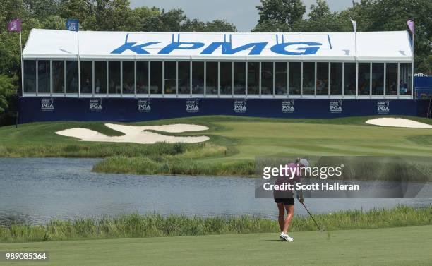 Stacy Lewis hits her approach shot on the 18th hole during the final round of the KPMG Women's PGA Championship at Kemper Lakes Golf Club on July 1,...
