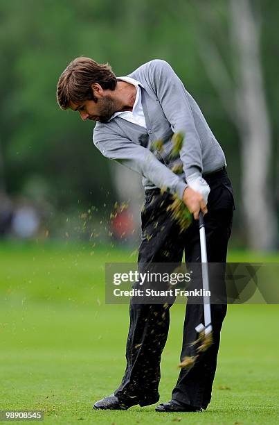 Robert Rock of England plays his approach shot on the 14th hole during the second round of the BMW Italian Open at Royal Park I Roveri on May 7, 2010...