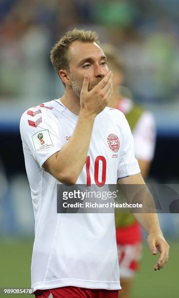 Christian Eriksen of Denmark looks dejected following his sides defeat in the 2018 FIFA World Cup Russia Round of 16 match between Croatia and...