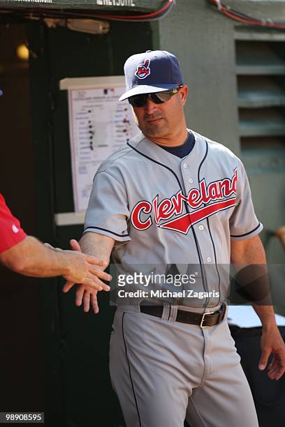 Manager Manny Acta of the Cleveland Indians standing in the dugout during the game against the Oakland Athletics at the Oakland Coliseum on April 24,...