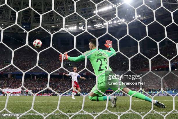 Simon Kjaer of Denmark scores past Danijel Subasic of Croatia his team's second penalty in the penalty shoot out during the 2018 FIFA World Cup...
