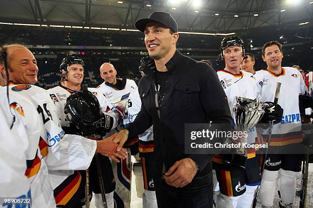 Wladimir Klitschko shake hands with the Germany legends team prior to the IIHF World Championship group D match between USA and Germany at Veltins...