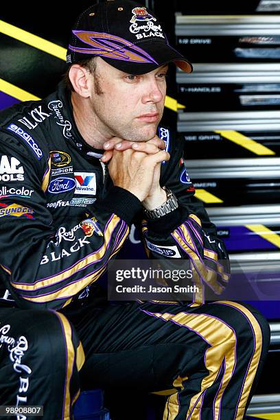 Matt Kenseth, driver of the Crown Royal Black Ford, sits in the garage during practice for the NASCAR Sprint Cup Series SHOWTIME Southern 500 at...