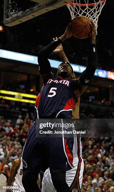 Josh Smith of the Atlanta Hawks puts the ball up over Kurt Thomas of the Milwaukee Bucks in Game Six of the Eastern Conference Quarterfinals during...