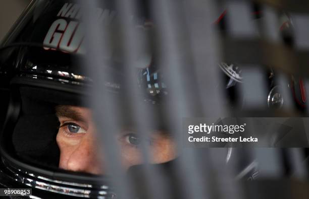 Jeff Gordon, driver of the DuPont Chevrolet, sits in his car during practice for the NASCAR Sprint Cup Series SHOWTIME Southern 500 at Darlington...