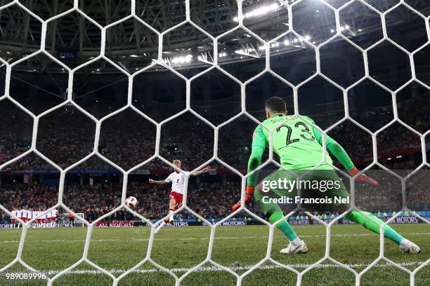 Simon Kjaer of Denmark scores past Danijel Subasic of Croatia his team's second penalty in the penalty shoot out during the 2018 FIFA World Cup...