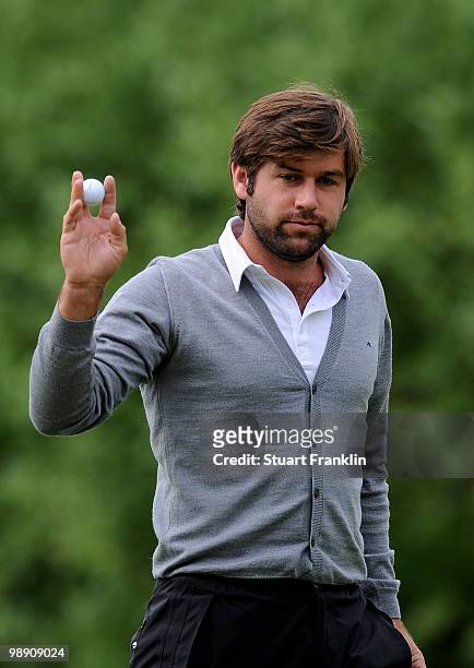 Robert Rock of England celebrates his putt on the ninth hole during the second round of the BMW Italian Open at Royal Park I Roveri on May 7, 2010 in...