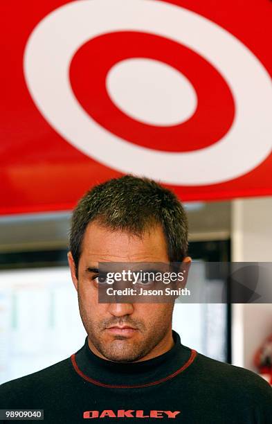 Juan Pablo Montoya, driver of the Target Chevorlet, stands in the garage area during practice for the NASCAR Sprint Cup Series SHOWTIME Southern 500...