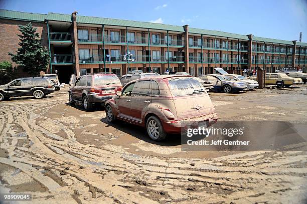 Muddy cars from flooding sit outside of the Knights Inn near downtown on May 7, 2010 in Nashville, Tennessee. Massive rainstorms caused at least 29...
