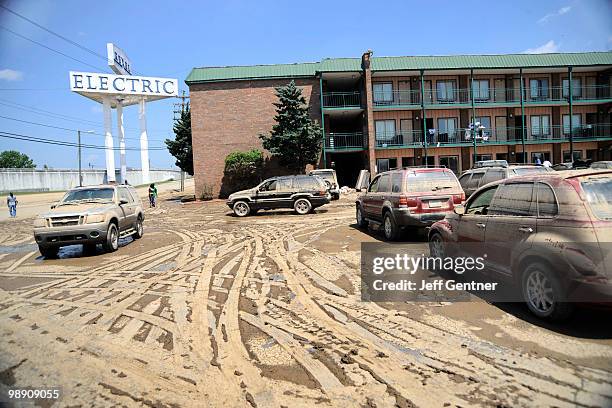 Muddy cars from flooding sit outside of the Knights Inn near downtown on May 7, 2010 in Nashville, Tennessee. Massive rainstorms caused at least 29...