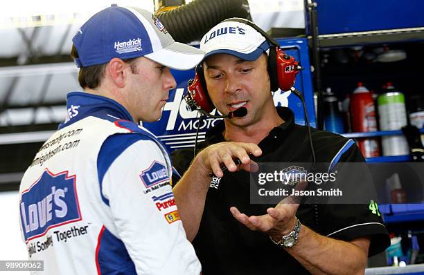 Jimmie Johnson , driver of the Lowe's Chevrolet speaks with crew chief Chad Knaus , during practice for the NASCAR Sprint Cup Series SHOWTIME...