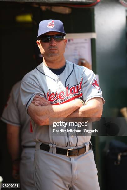 Manager Manny Acta of the Cleveland Indians standing in the dugout during the game against the Oakland Athletics at the Oakland Coliseum on April 24,...
